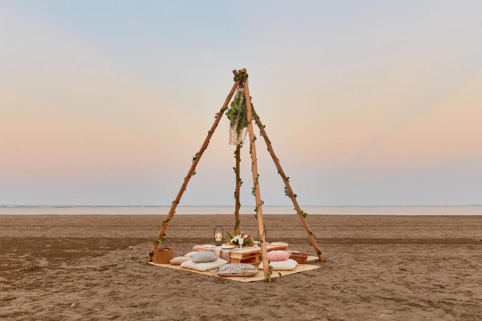 Grand Fiesta Americana Veracruz Exterior foto A teepee tent on a beach